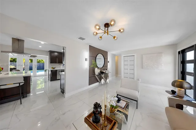 a view of a livingroom with furniture and a flat screen tv