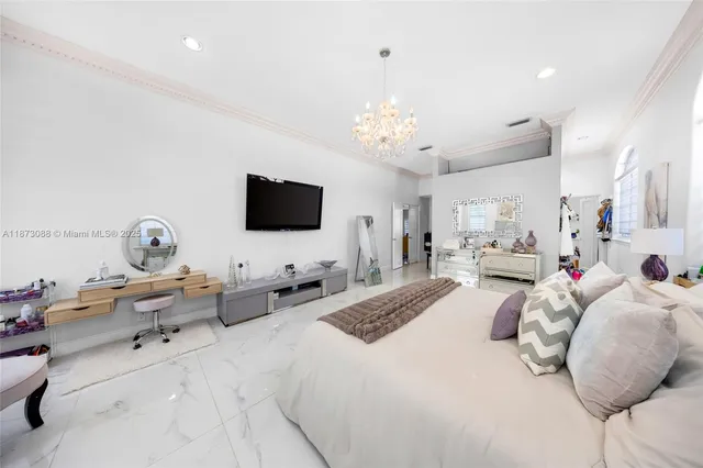 a living room with furniture kitchen view and a flat screen tv