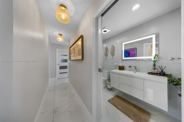 a room with a mirror and furniture