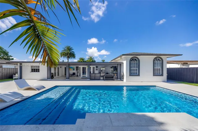 a view of house with yard outdoor seating and entertaining space