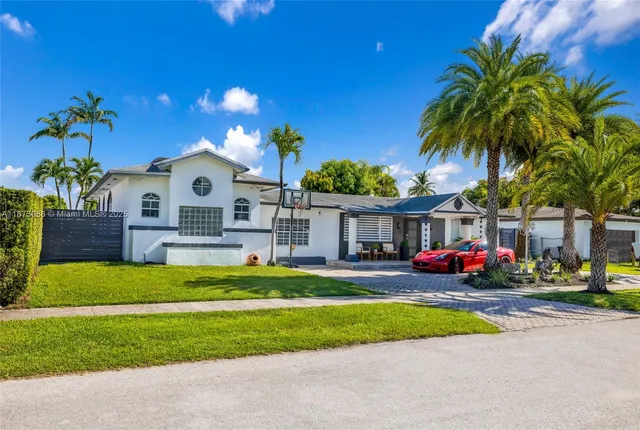 a front view of a house with garden and porch