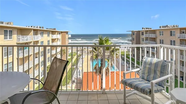 a view of balcony with furniture