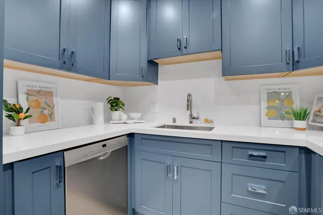 a kitchen with a sink and cabinets
