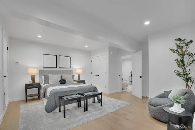 a bedroom with furniture and a bed