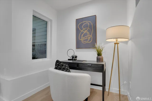 a table with a chair and a lamp on a table