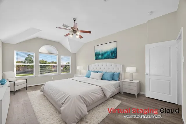 a spacious bedroom with a large bed and a large window