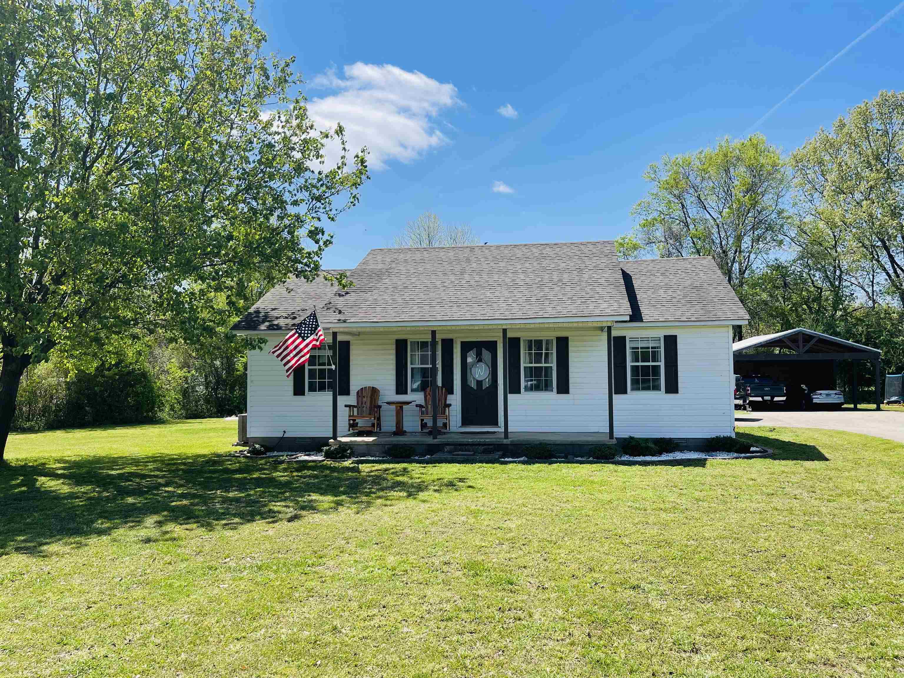 207 Chris Lane Ramer, TN 38367 - Photo 1 of 15 a front view of a house with garden