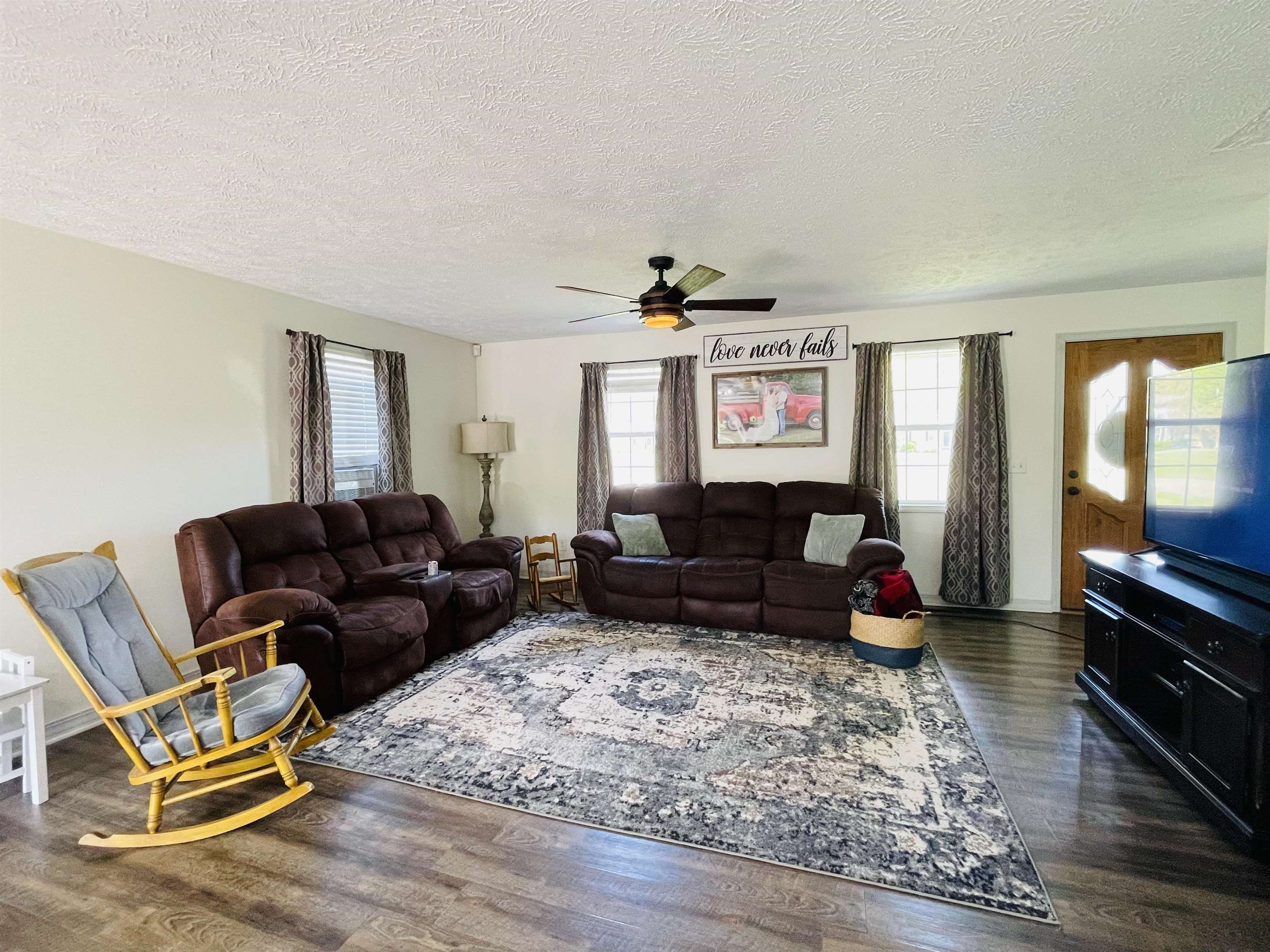 207 Chris Lane Ramer, TN 38367 - Photo 2 of 15 a living room with furniture window and wooden floor
