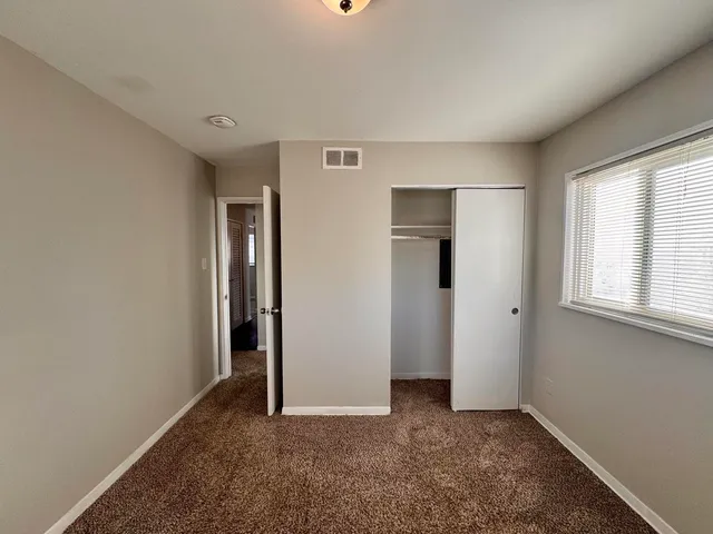 a view of backyard space and tree