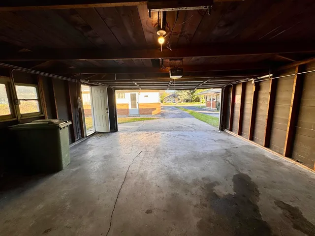 a view of house with backyard