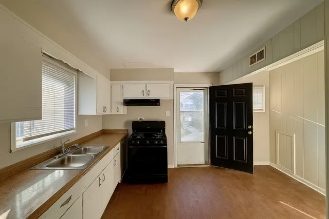 a bathroom with a toilet a sink and bathtub