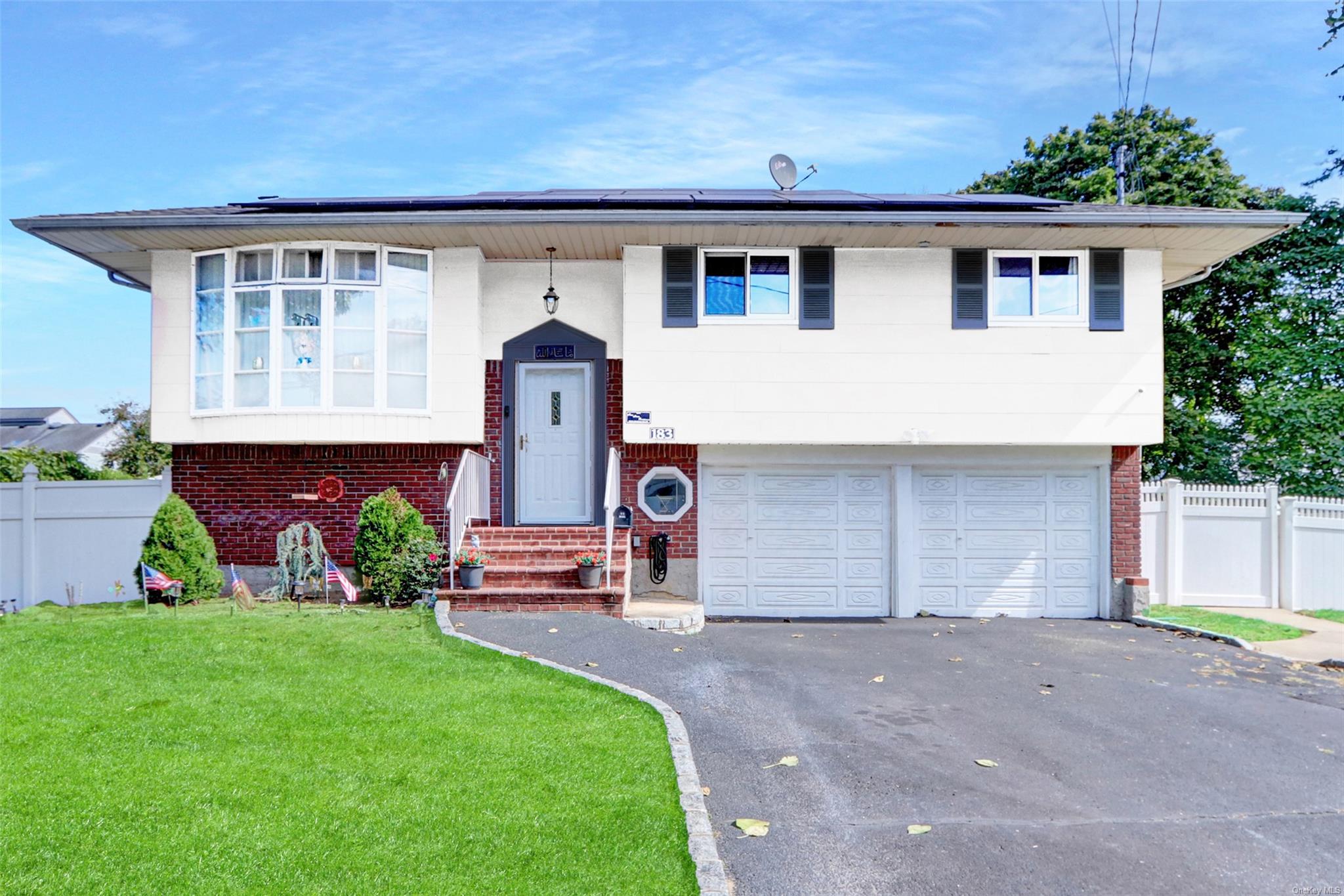 a view of house with outdoor space and yard