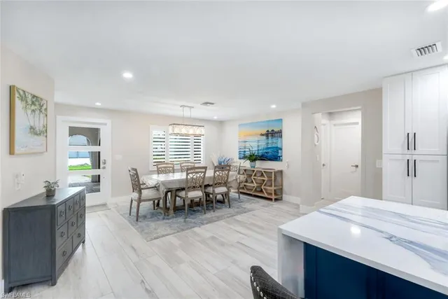 a living room with furniture window and wooden floor