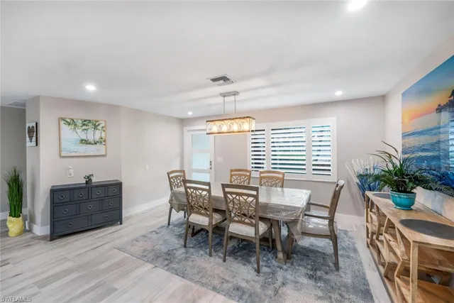 a view of a dining room with furniture and window