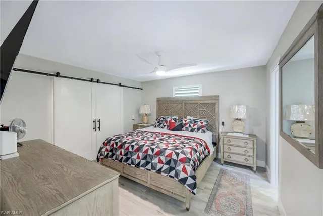 a bedroom with a bed and a cabinets