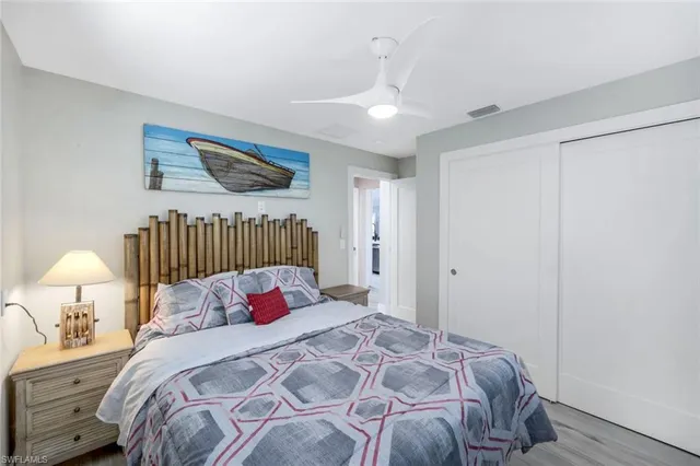 a bedroom with a bed and a lamp