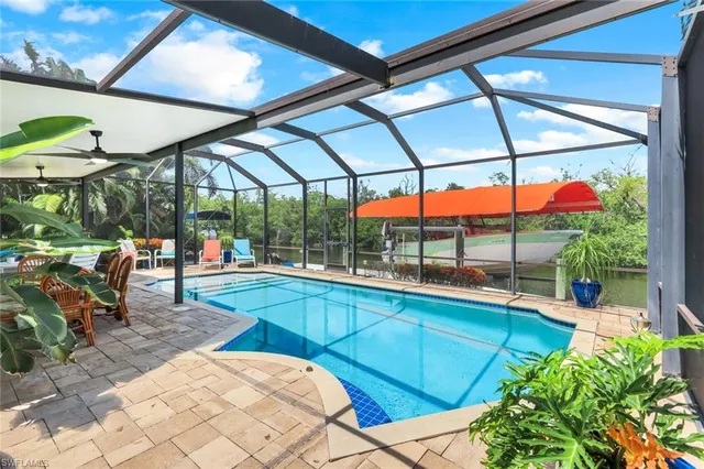 a view of a swimming pool with a patio