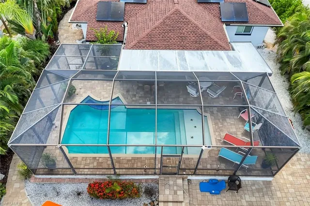 an aerial view of a house with a garden