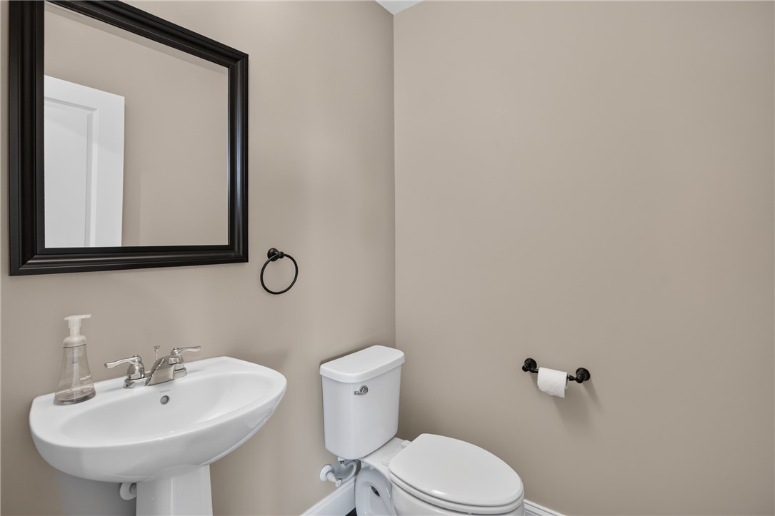 2007 Aberdeen Lane Walhalla, SC 29691 - Photo 14 of 41 A tidy powder room featuring a modern pedestal sink and essential fixtures.