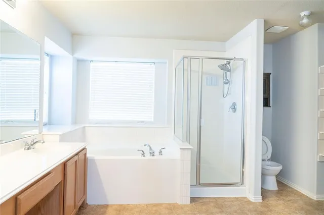 a bathroom with a bathtub sink and toilet