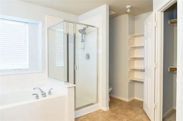 a bathroom with a tub and a sink