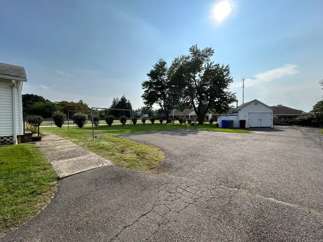 a view of backyard with green space