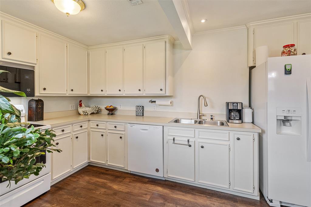 713 Midway Road Tool, TX 75143 - Photo 5 of 28 a kitchen with sink cabinets and wooden floor