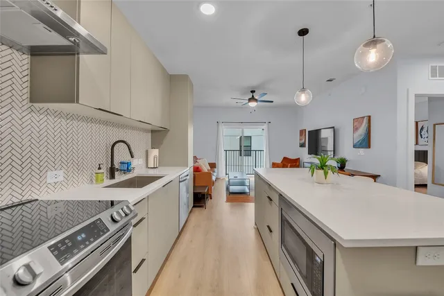 a view of a terrace with furniture and city view