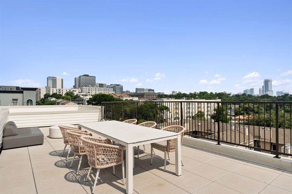 2500 Longview Street, Unit 217 Austin, TX 78705 - Photo 33 of 35 View of patio / terrace with a skyline view and outdoor dining area