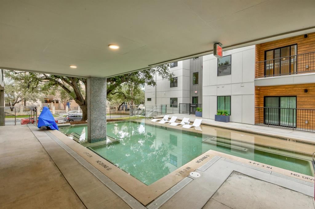2500 Longview Street, Unit 217 Austin, TX 78705 - Photo 6 of 35 Community pool with a patio area