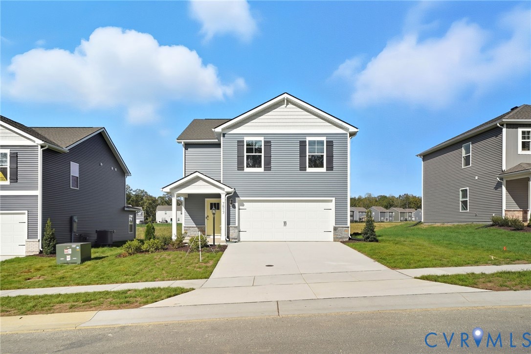 7731 Arbor Marsh Terrace New Kent, VA 23124 - Photo 1 of 37 a front view of a house with a yard