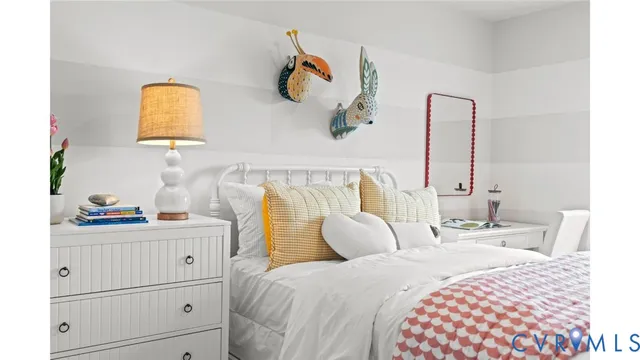 a bedroom with a bed and a mirror