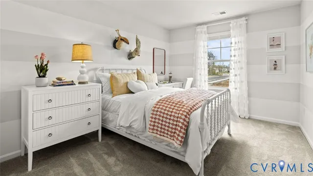 a bedroom with a bed and a dresser