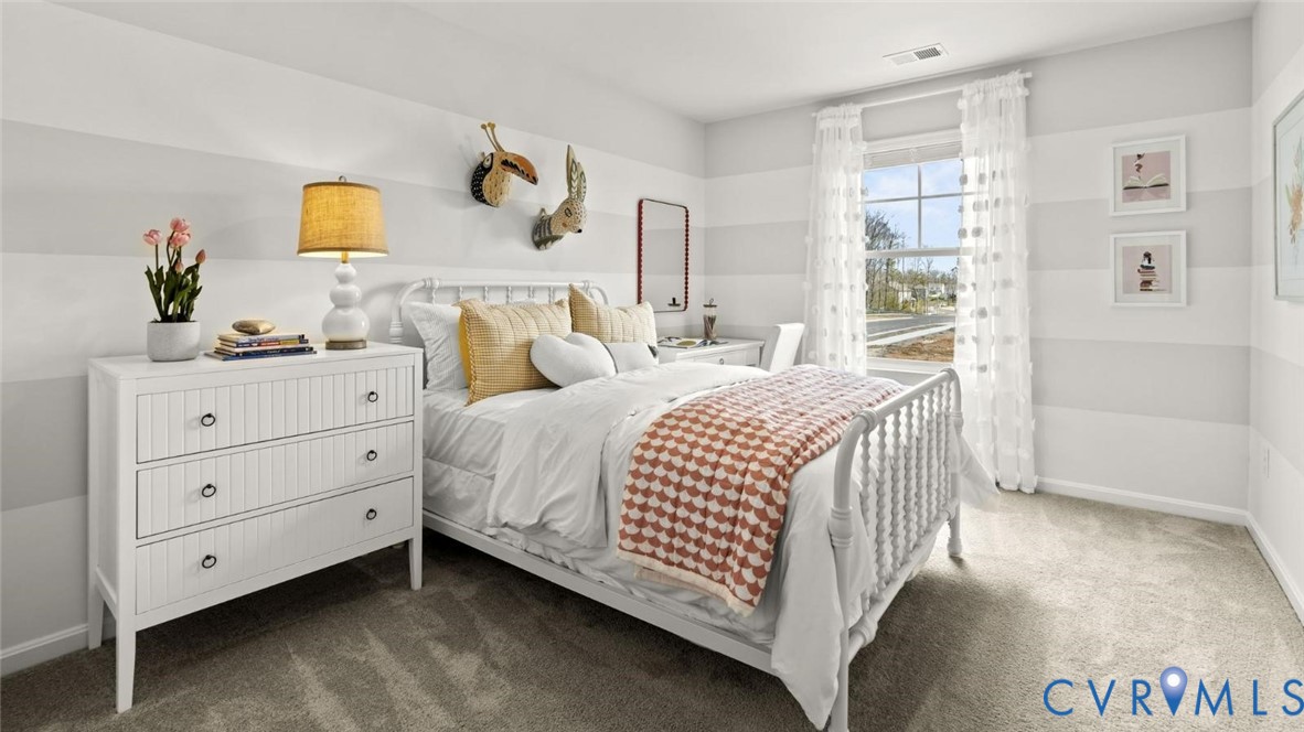 7731 Arbor Marsh Terrace New Kent, VA 23124 - Photo 19 of 37 a bedroom with a bed and a dresser