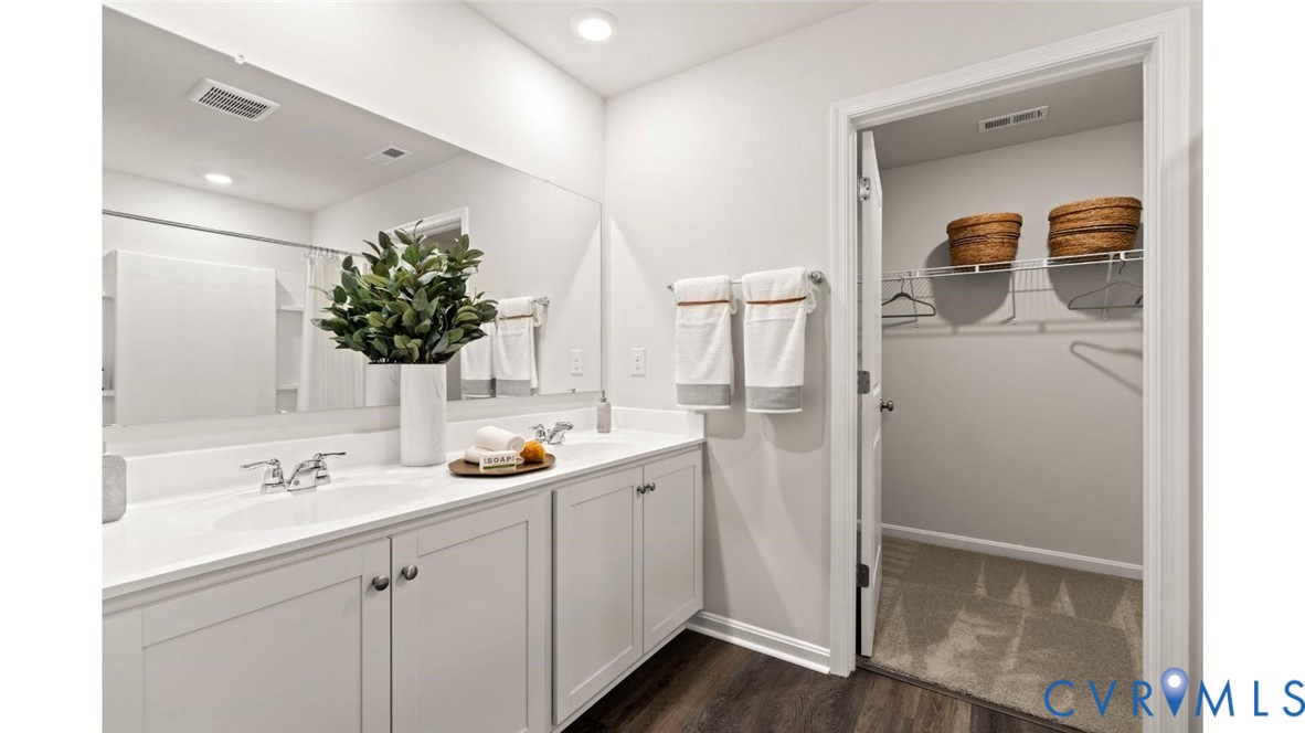 7731 Arbor Marsh Terrace New Kent, VA 23124 - Photo 22 of 37 a bathroom with a sink and a mirror
