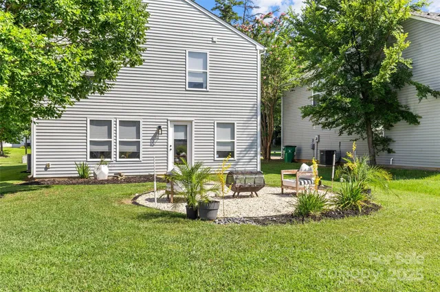 a house view with a sitting space and garden