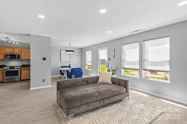 a bedroom with a large bed and a couch