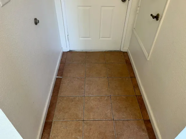 a bathroom with a shower and a mirror