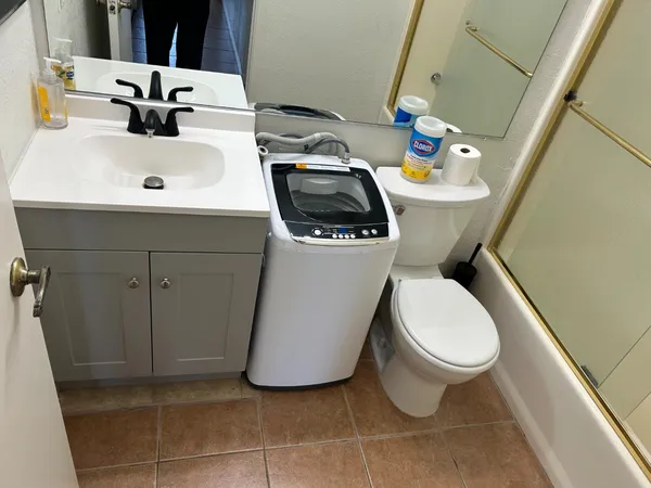 a bathroom with a toilet and a sink