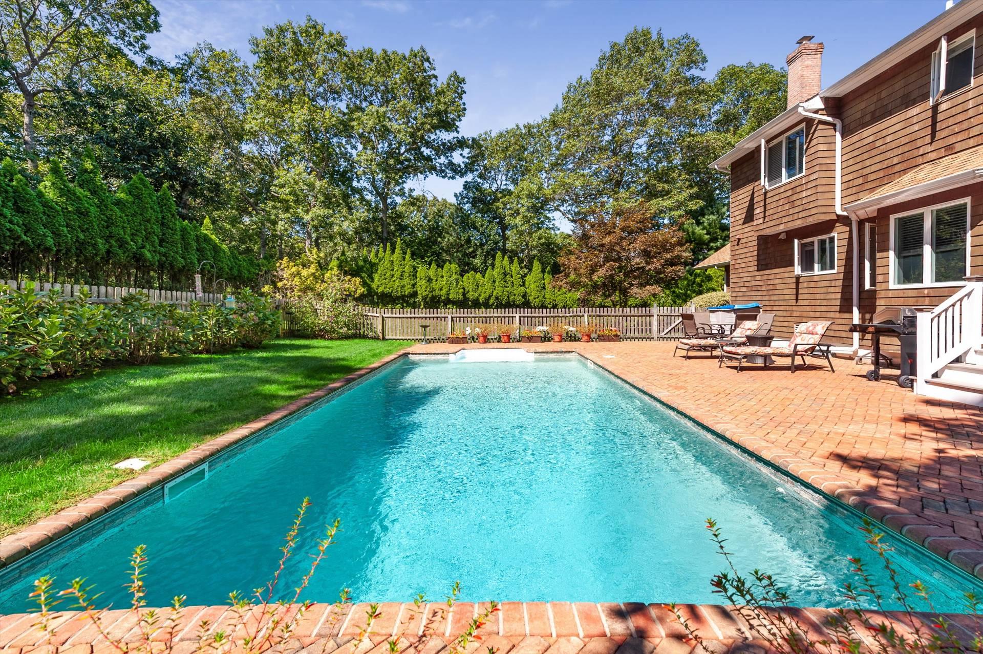67 Straight Path Southampton, NY 11968 - Photo 18 of 23 View of swimming pool featuring a patio, a fenced backyard, and view of scattered trees