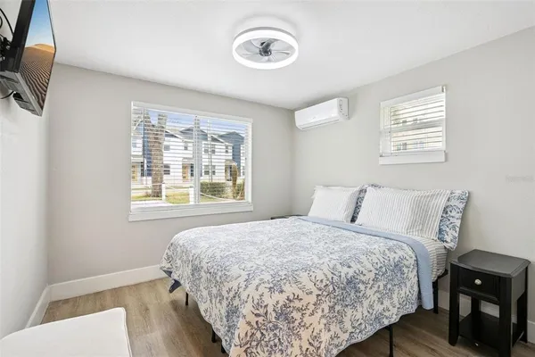 a bedroom with a bed and a window