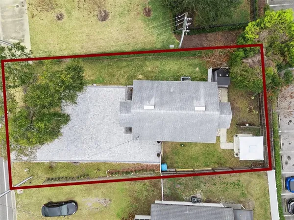 an aerial view of residential house with outdoor space
