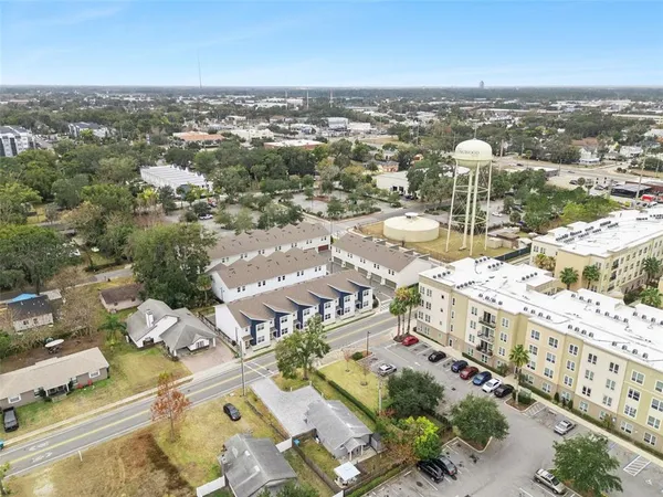 an aerial view of a city with parking