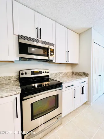 a bathroom with a sink a mirror and a toilet