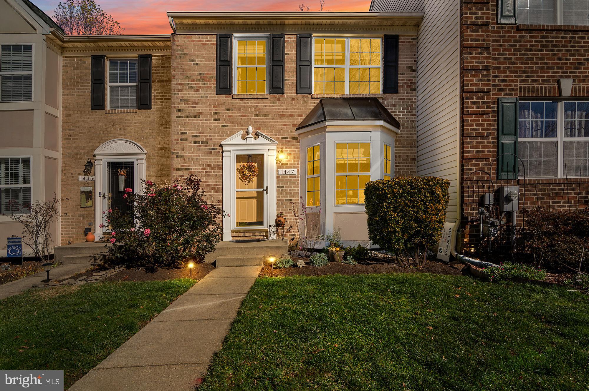 1447 Falcon Nest Court, Unit 45 Arnold, MD 21012 - Photo 1 of 58 a front view of a house with a yard