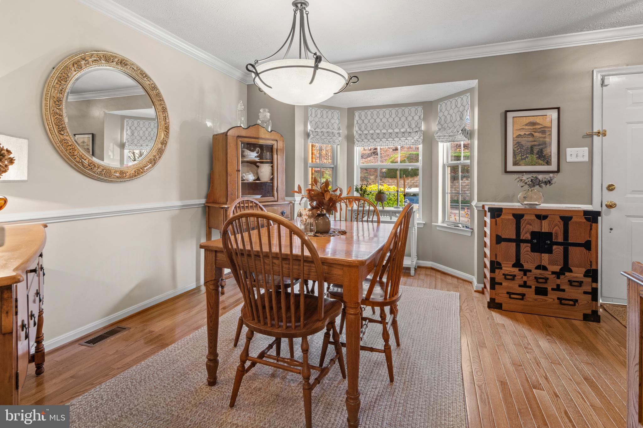 1447 Falcon Nest Court, Unit 45 Arnold, MD 21012 - Photo 11 of 58 a view of a dining room with furniture window and wooden floor
