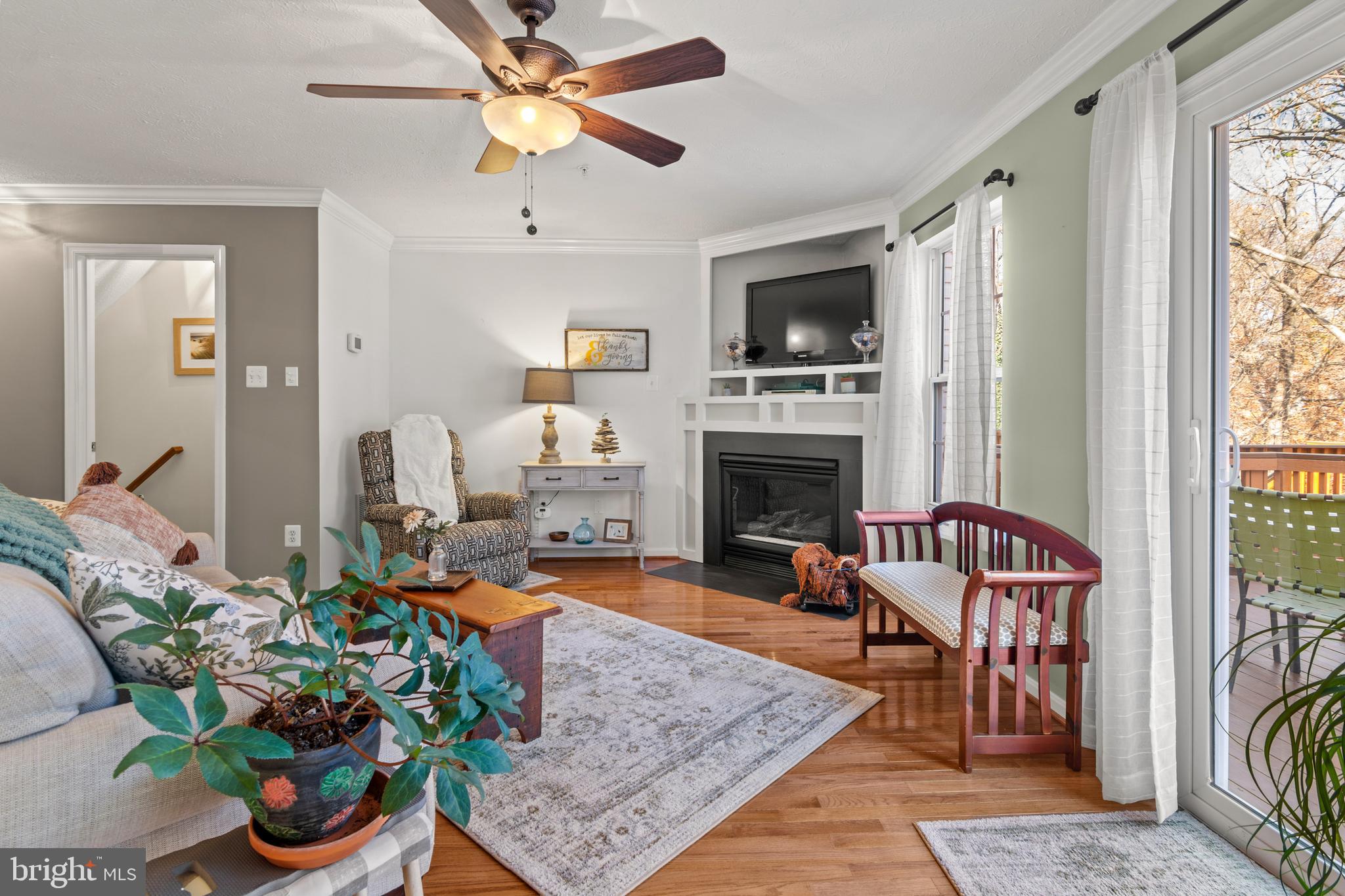 1447 Falcon Nest Court, Unit 45 Arnold, MD 21012 - Photo 20 of 58 a living room with furniture fireplace and flat screen tv