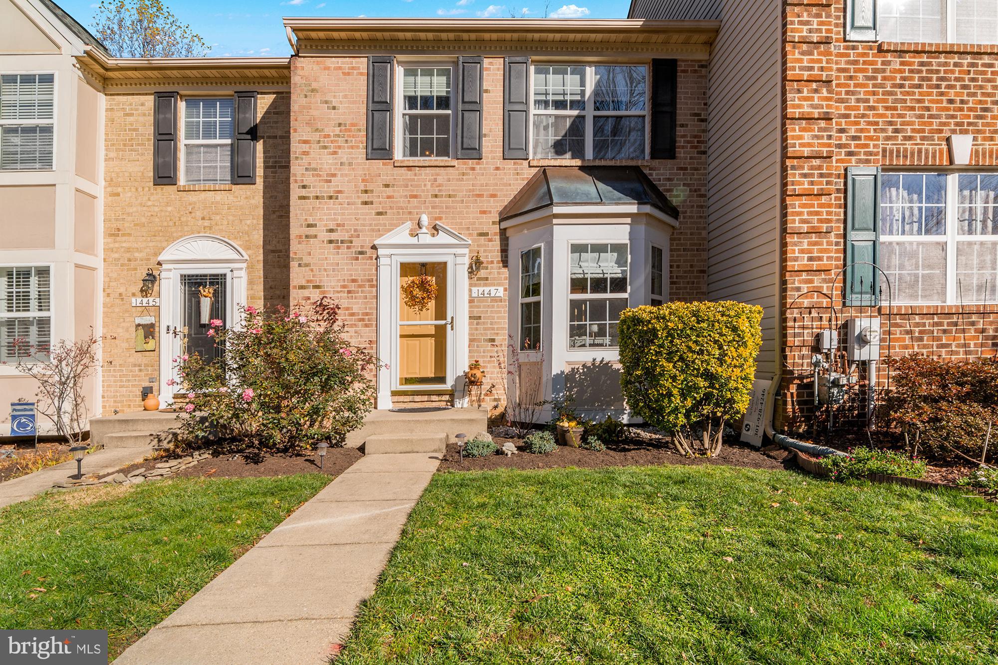 1447 Falcon Nest Court, Unit 45 Arnold, MD 21012 - Photo 2 of 58 a front view of a house with a yard