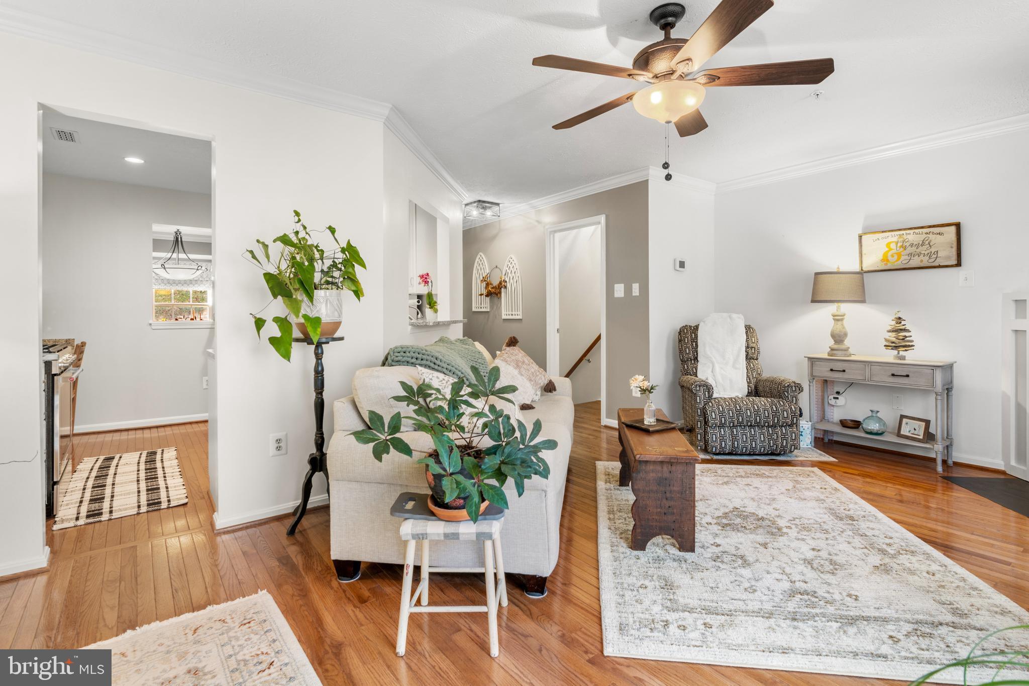 1447 Falcon Nest Court, Unit 45 Arnold, MD 21012 - Photo 21 of 58 a living room with furniture and a chandelier