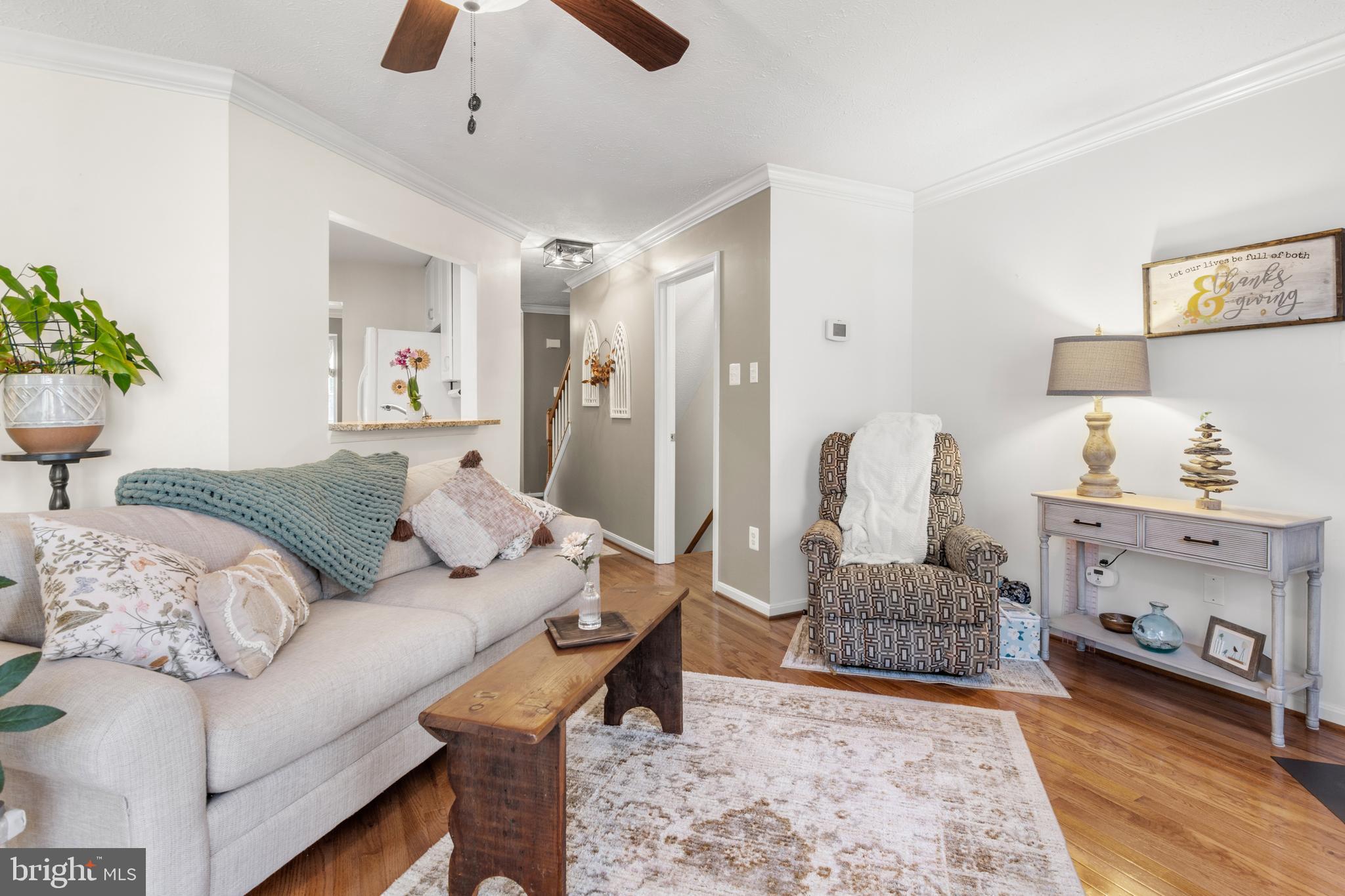 1447 Falcon Nest Court, Unit 45 Arnold, MD 21012 - Photo 23 of 58 a living room with furniture and a couch